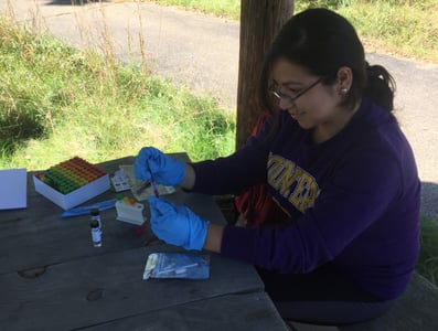 Student working with Biomeme sample extraction kit with Dr. Amy Prunuske.