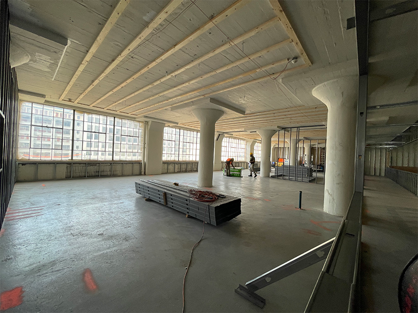 big room with construction materials in new headquarters space