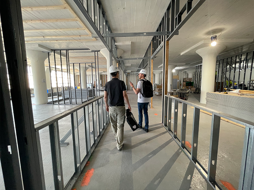 Cofounders walk through construction